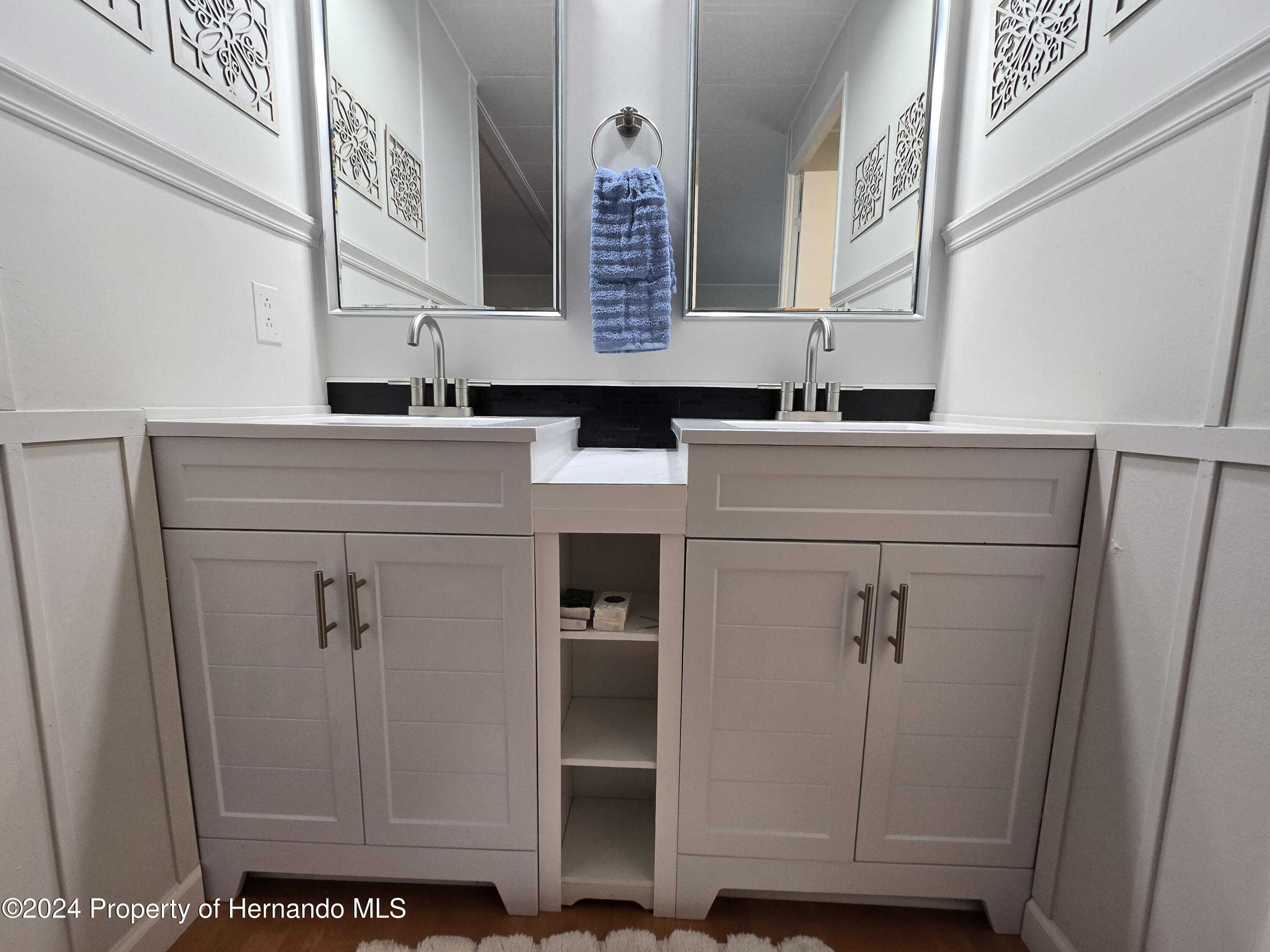 15260 Brookridge Boulevard Brooksville, FL 34613 - Photo 40 of 56 a view of cabinets and a wooden floor