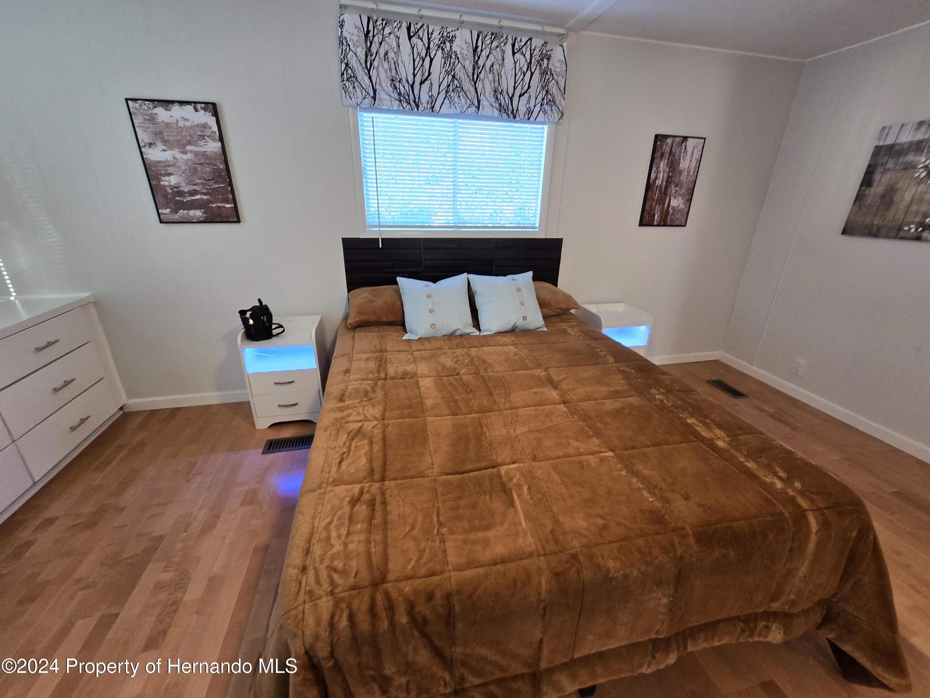 15260 Brookridge Boulevard Brooksville, FL 34613 - Photo 47 of 56 a bedroom with a bed and window