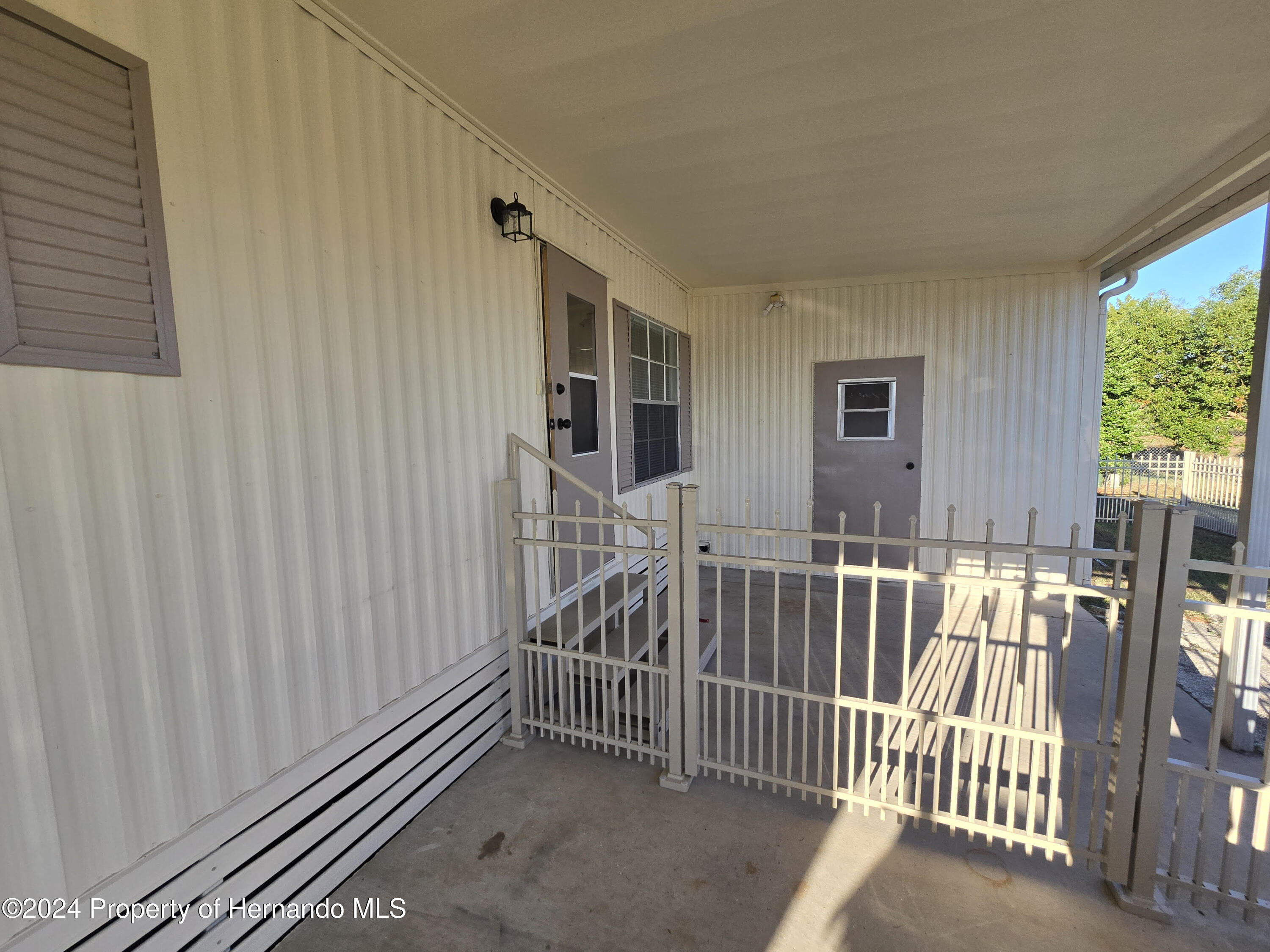 15260 Brookridge Boulevard Brooksville, FL 34613 - Photo 50 of 56 Side of house 2nd entrance