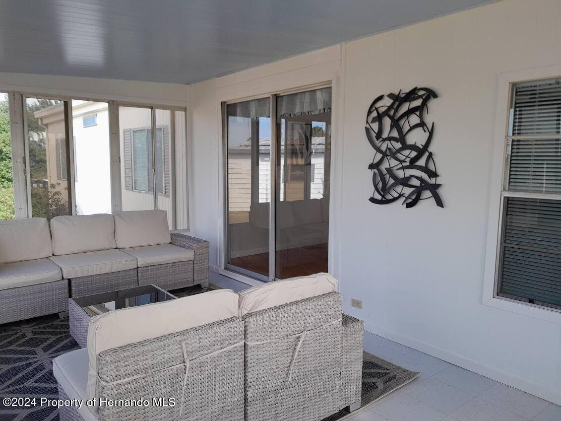 15260 Brookridge Boulevard Brooksville, FL 34613 - Photo 54 of 56 a living room with furniture and window