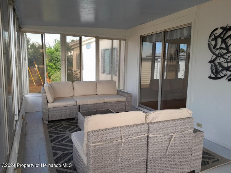 15260 Brookridge Boulevard Brooksville, FL 34613 - Photo 55 of 56 a bedroom with a bed and a window