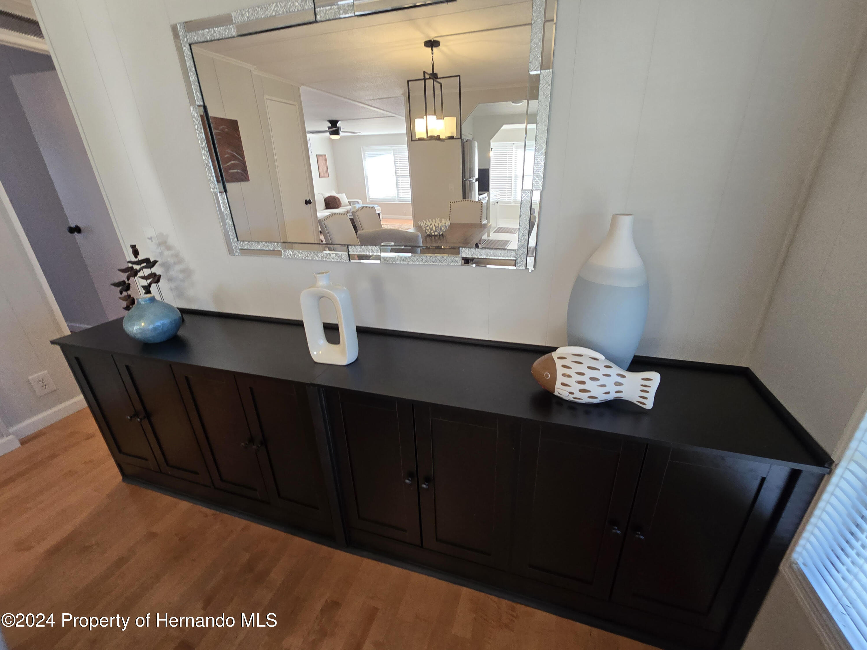 15260 Brookridge Boulevard Brooksville, FL 34613 - Photo 9 of 56 a bathroom with a sink and a mirror