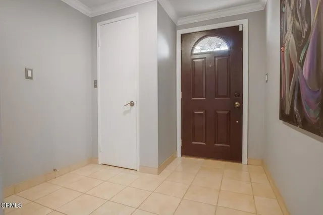 an empty room that has a mirror