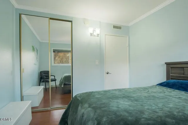 a view of a livingroom with furniture and hardwood floor