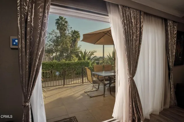 a bath room with a large window and outer view