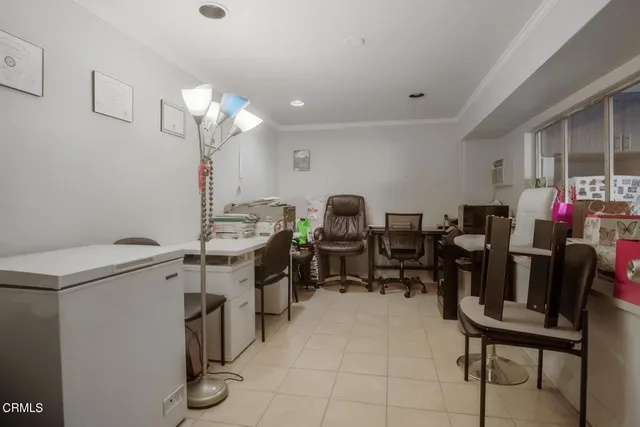 a view of dining room and kitchen with a table chairs and a window