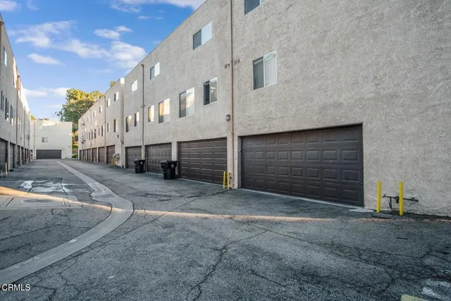 a view of a house with a street