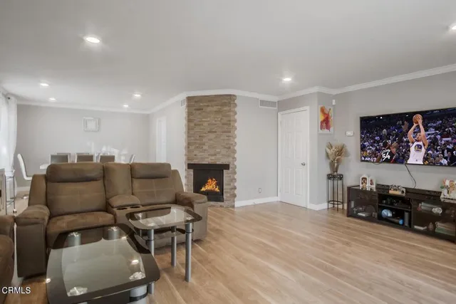 a living room with furniture and a fireplace