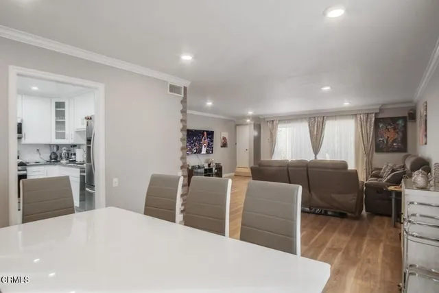 a large bedroom with furniture and a wooden floor