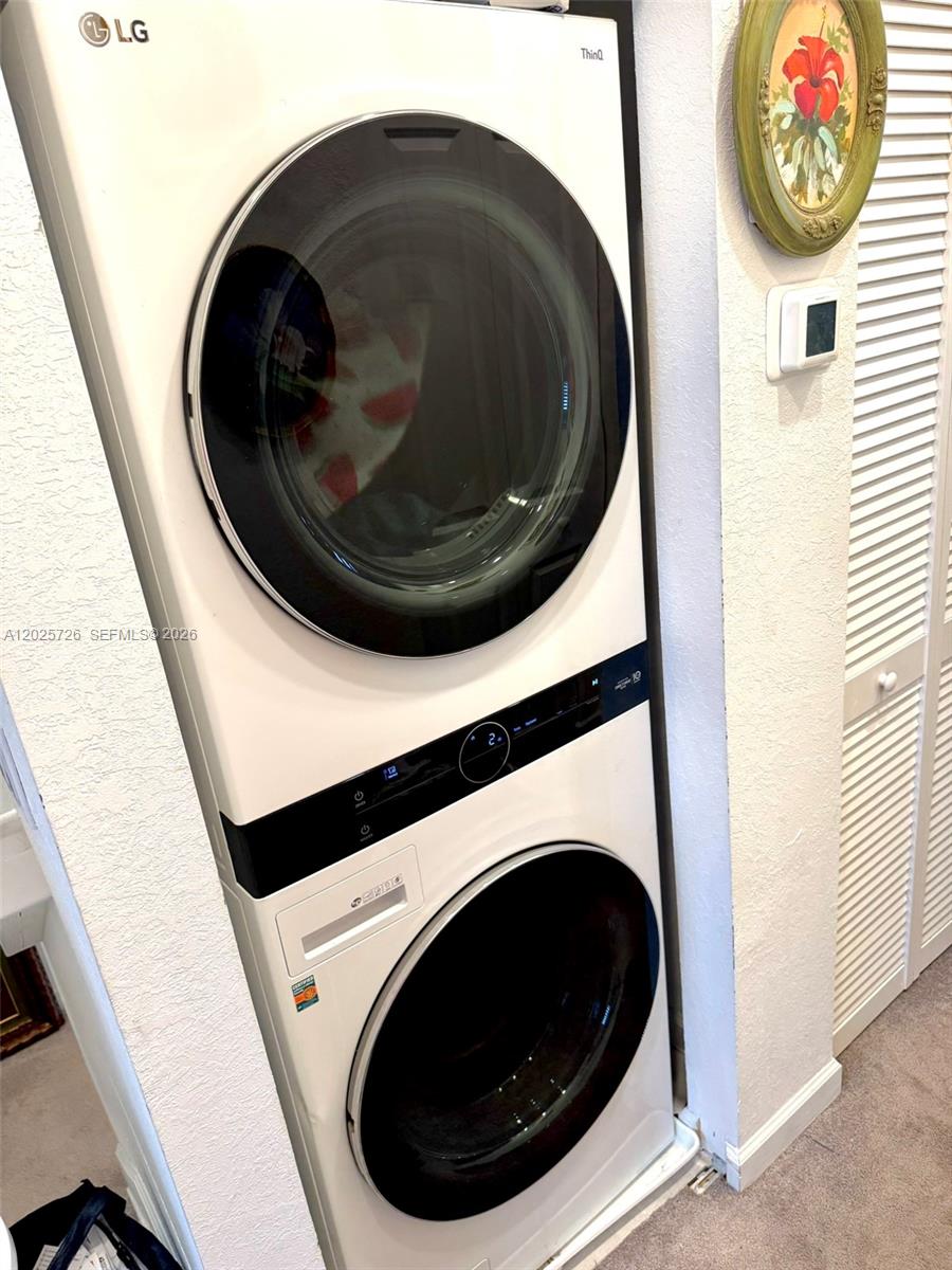 10020 Southwest 228th Terrace Miami, FL 33190 - Photo 18 of 22 a close up view of washer and dryer