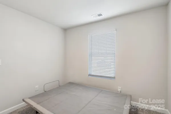 a view of a room that has a window in it