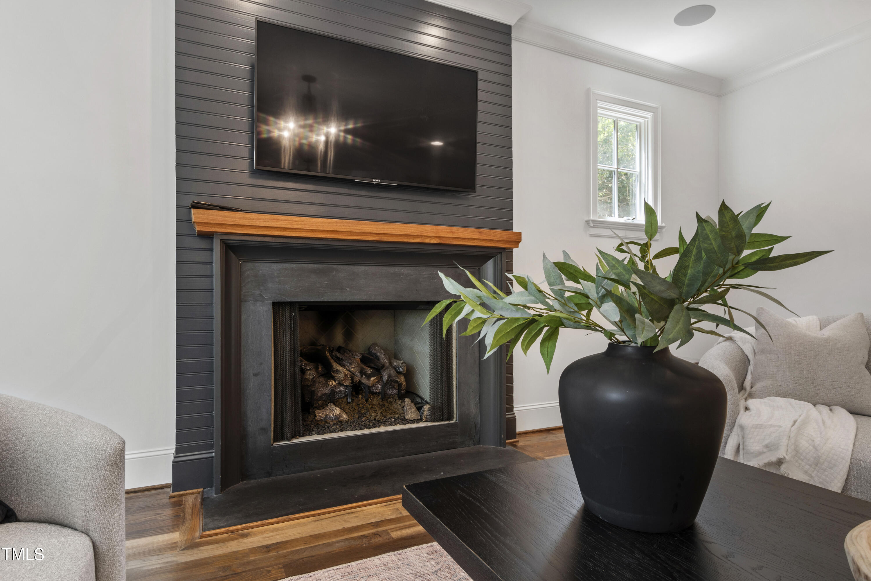 523 Vick Avenue Raleigh, NC 27612 - Photo 10 of 77 a view of a livingroom with furniture and a potted plant