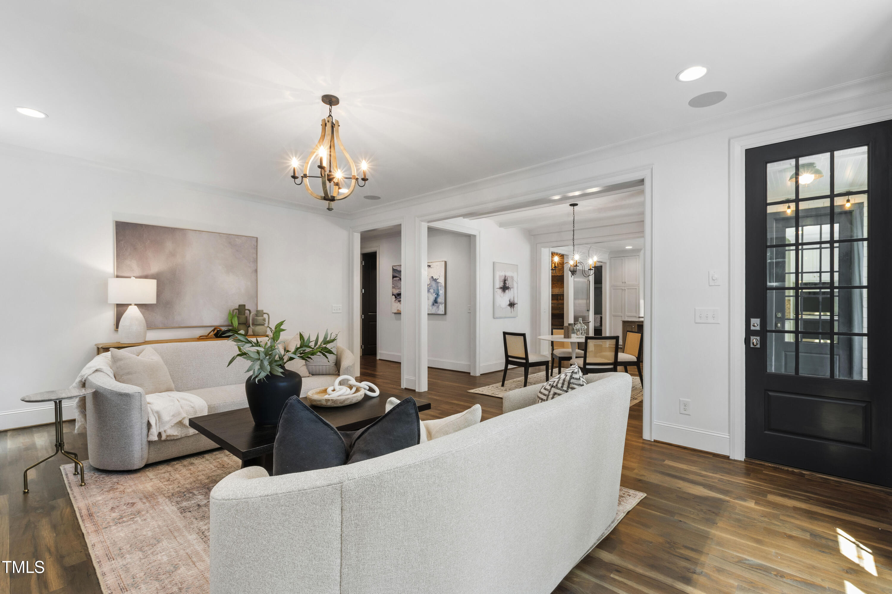 523 Vick Avenue Raleigh, NC 27612 - Photo 11 of 77 a living room with furniture and a chandelier