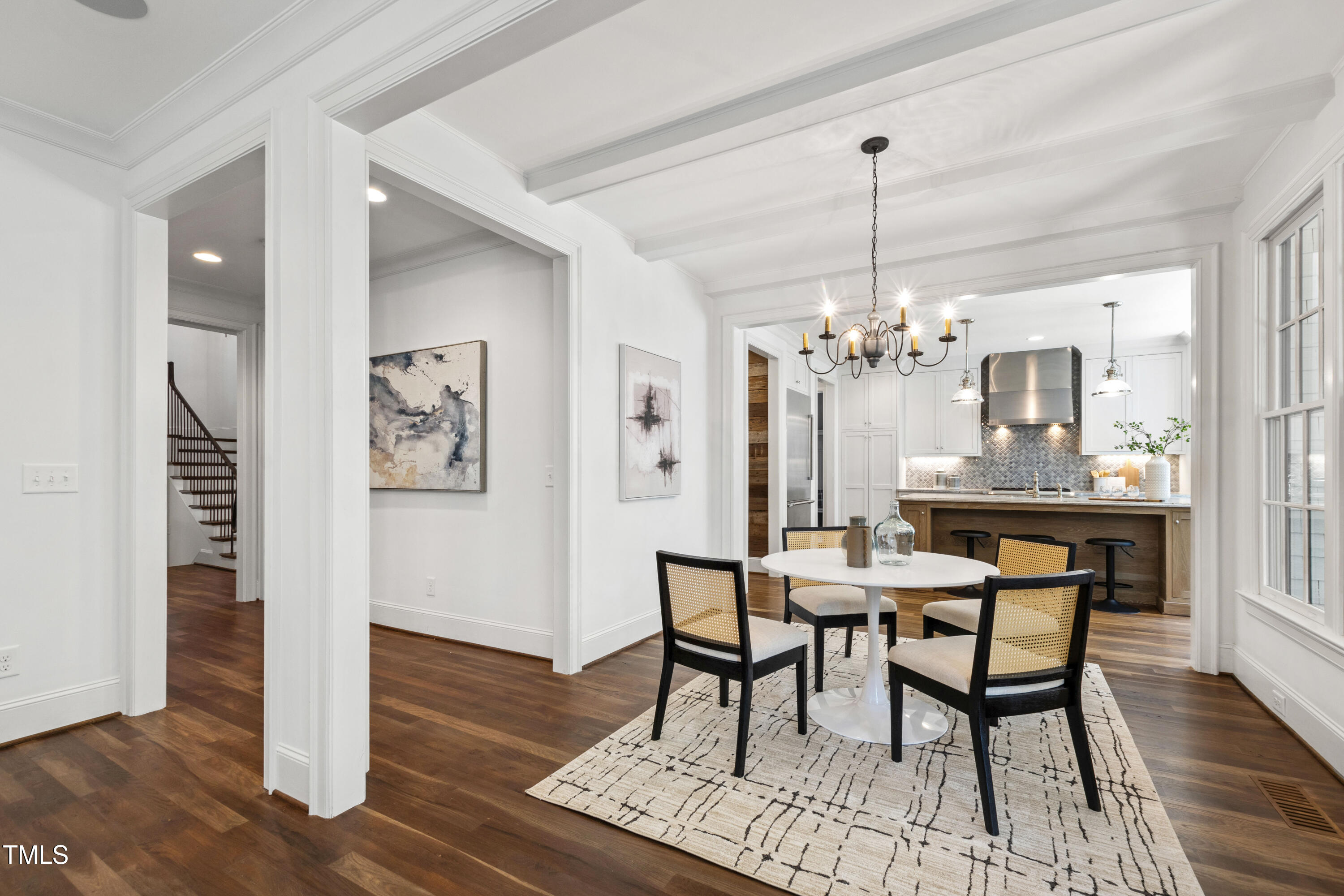 523 Vick Avenue Raleigh, NC 27612 - Photo 13 of 77 a view of a dining room with furniture wooden floor and chandelier