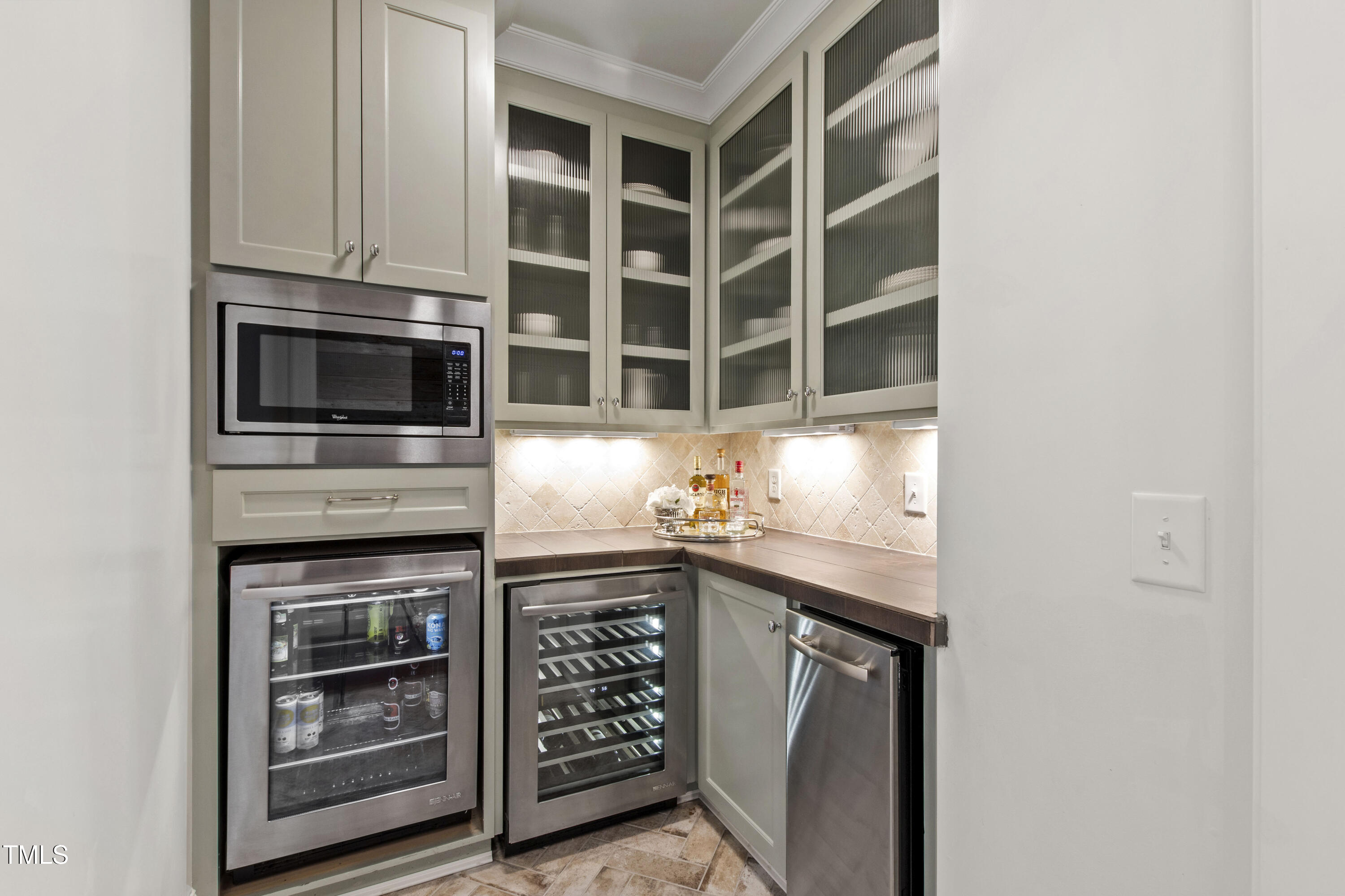 523 Vick Avenue Raleigh, NC 27612 - Photo 23 of 77 a kitchen with stainless steel appliances a stove and a microwave