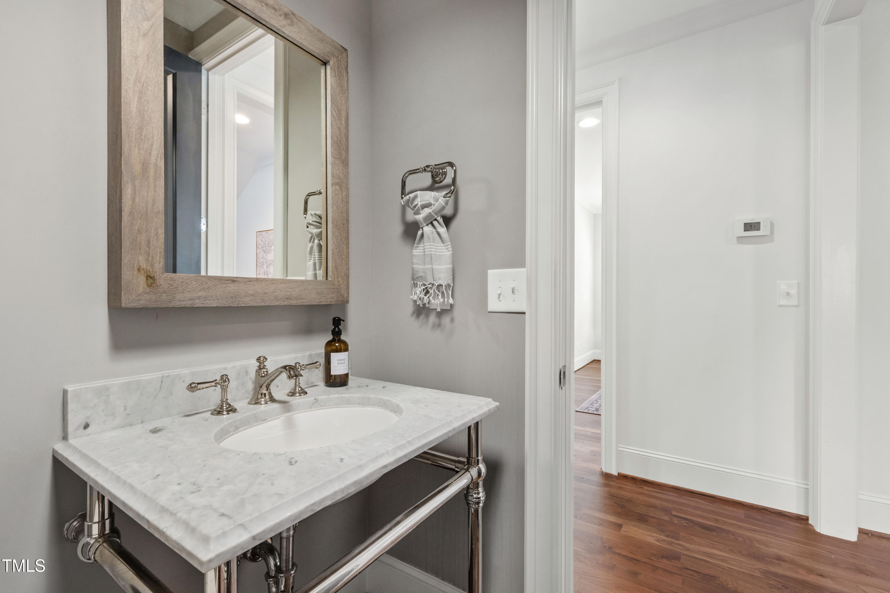 523 Vick Avenue Raleigh, NC 27612 - Photo 25 of 77 a bathroom with a granite countertop sink and a mirror