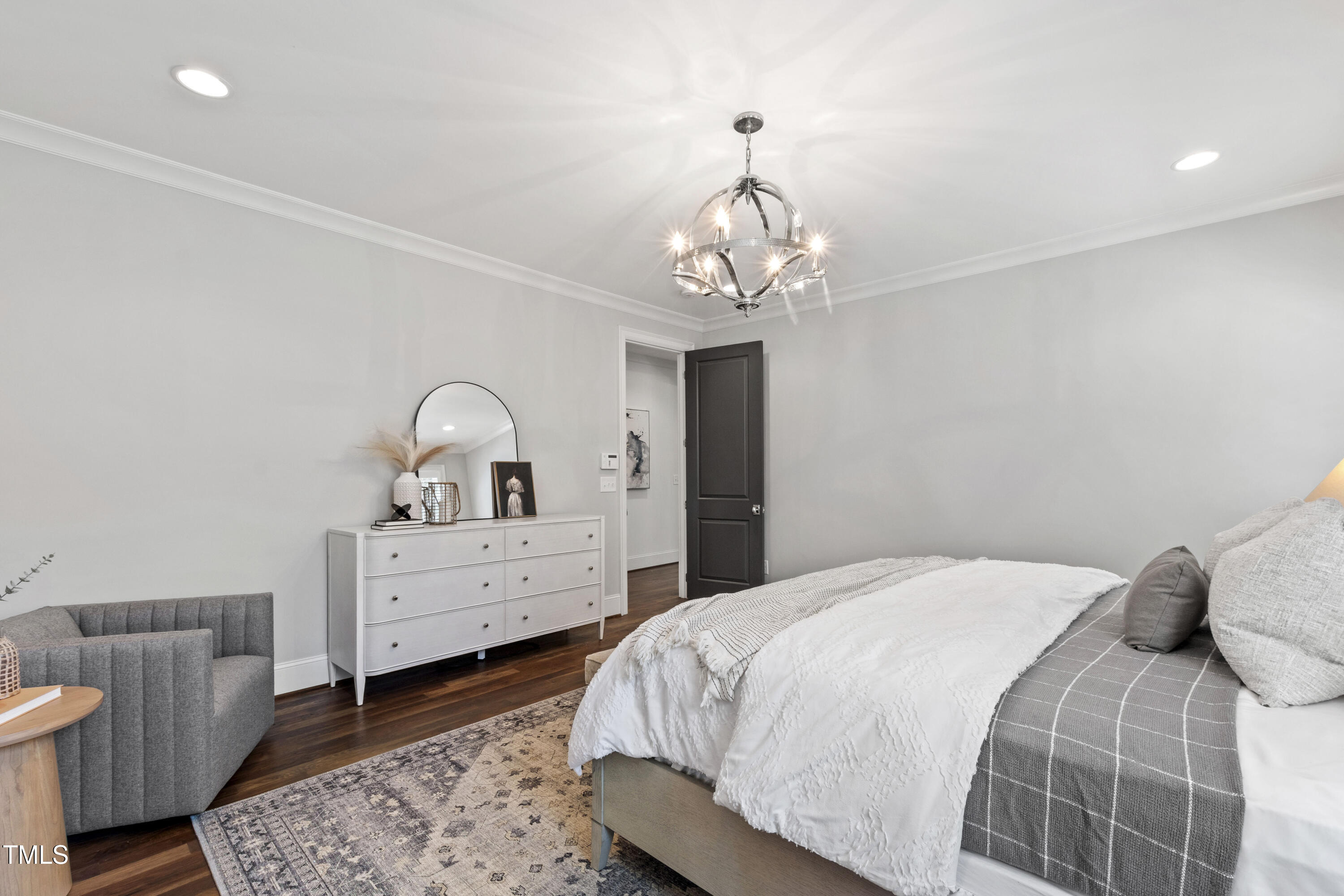 523 Vick Avenue Raleigh, NC 27612 - Photo 28 of 77 a bedroom with a bed and a dresser