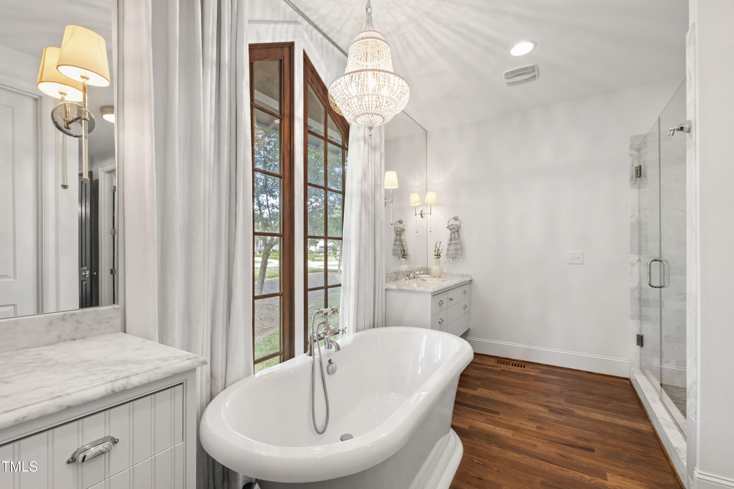523 Vick Avenue Raleigh, NC 27612 - Photo 30 of 77 a bathroom with a granite countertop sink and a mirror