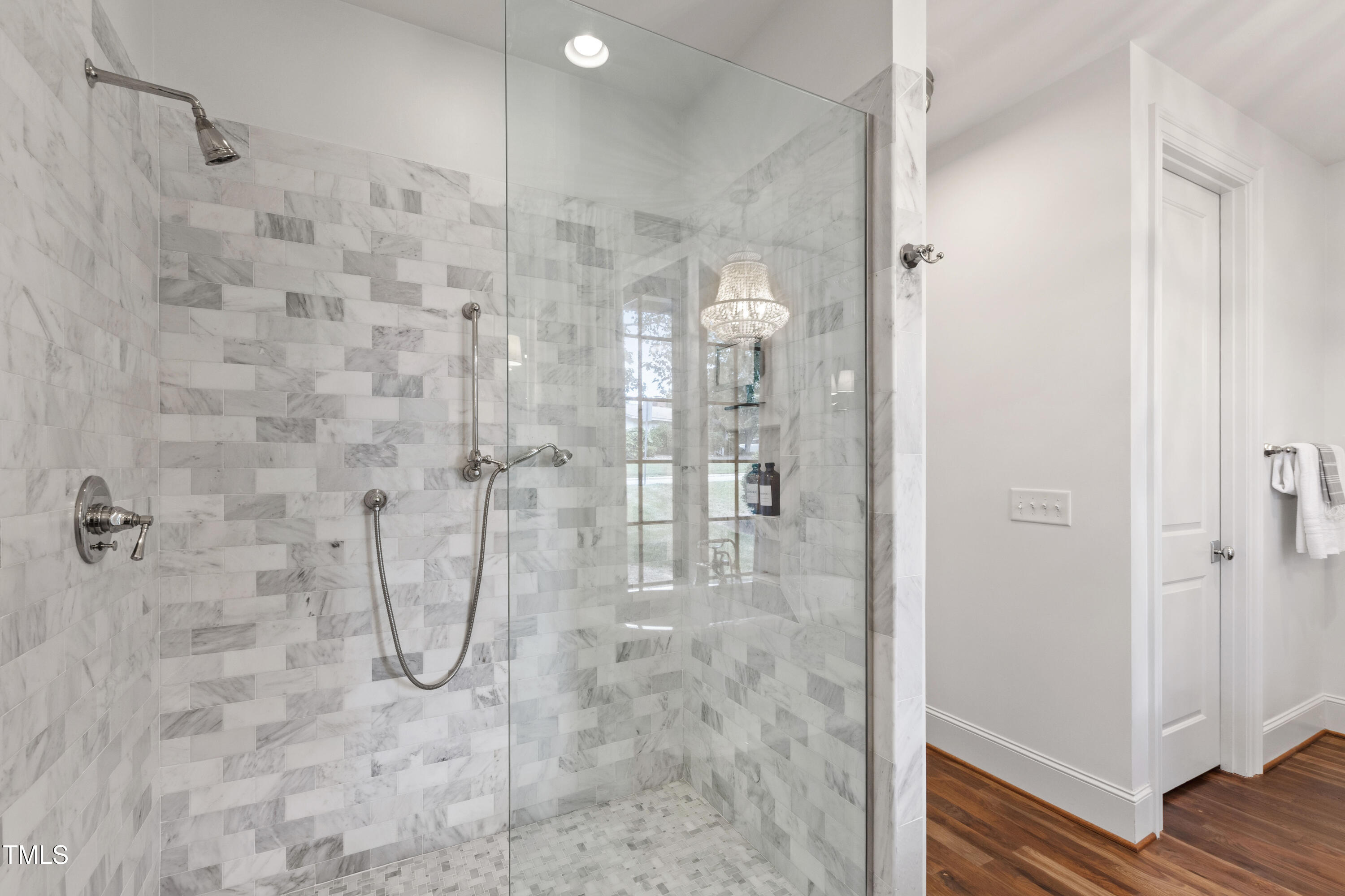 523 Vick Avenue Raleigh, NC 27612 - Photo 32 of 77 a bathroom with a glass shower door