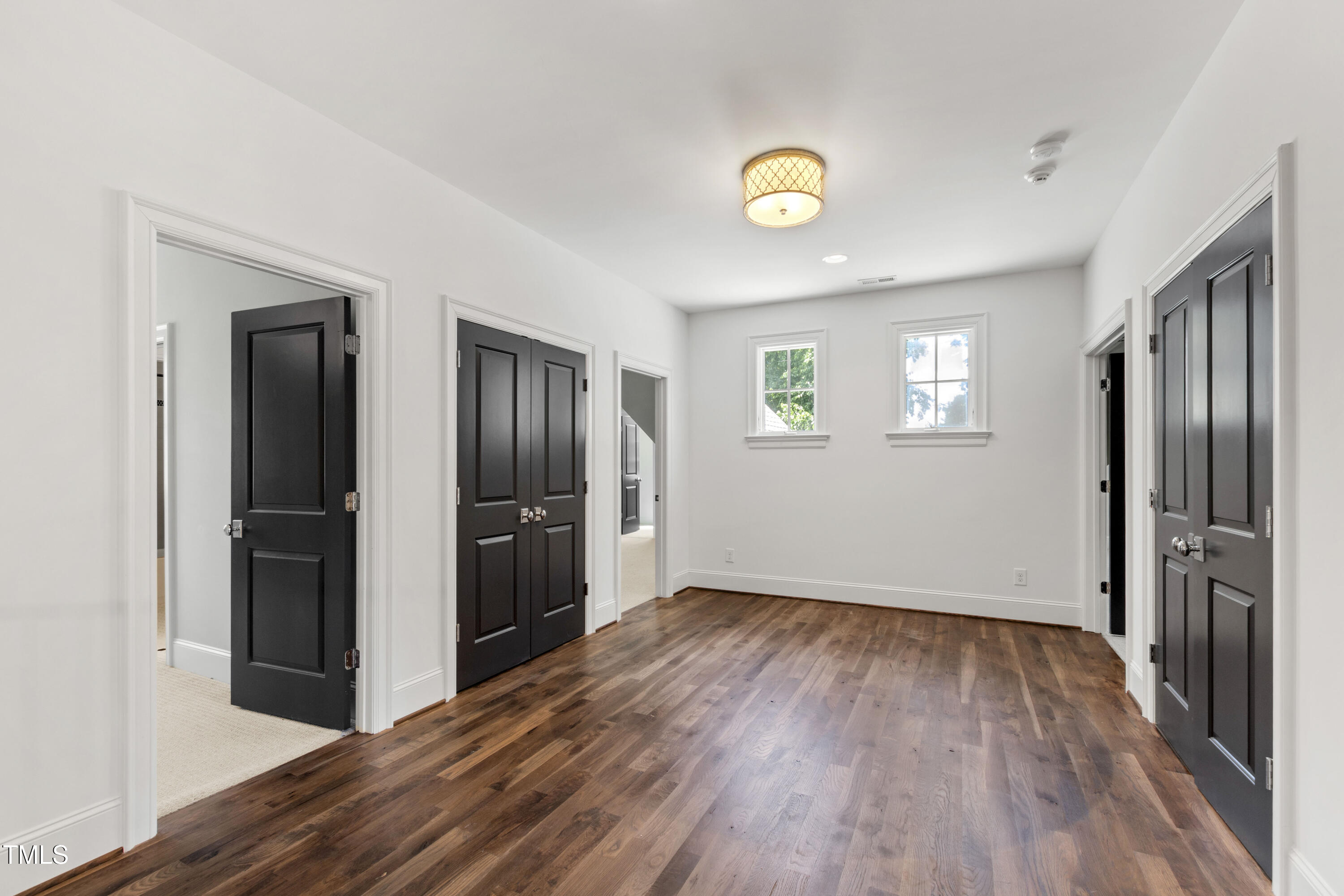 523 Vick Avenue Raleigh, NC 27612 - Photo 39 of 77 a view of an empty room with a window and wooden floor