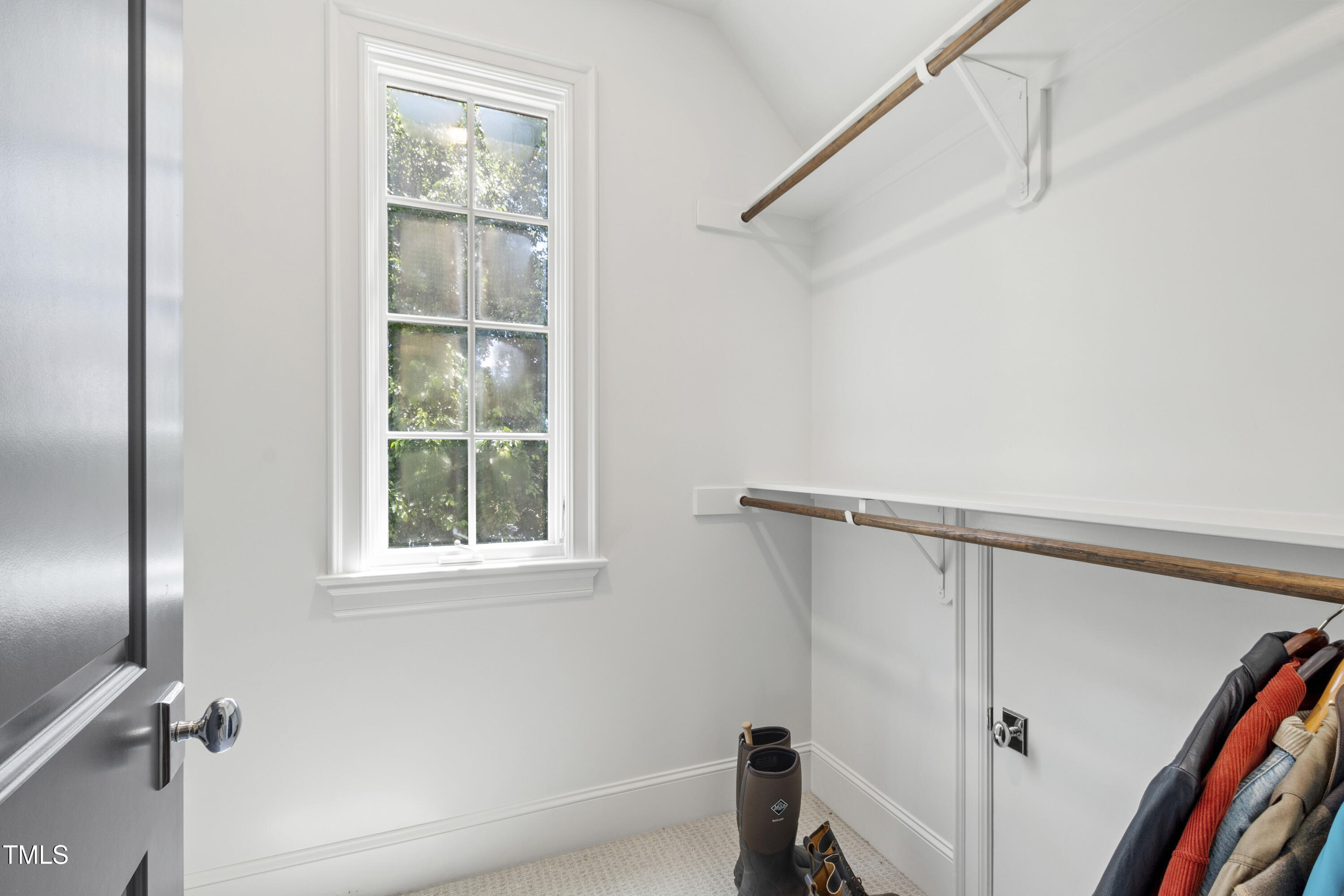 523 Vick Avenue Raleigh, NC 27612 - Photo 41 of 77 a view of a room that has a window and wooden floor