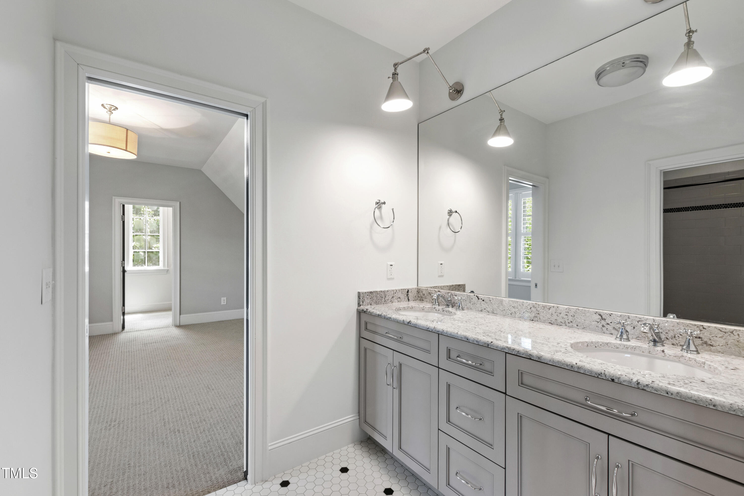523 Vick Avenue Raleigh, NC 27612 - Photo 42 of 77 a bathroom with a granite countertop sink mirror and double