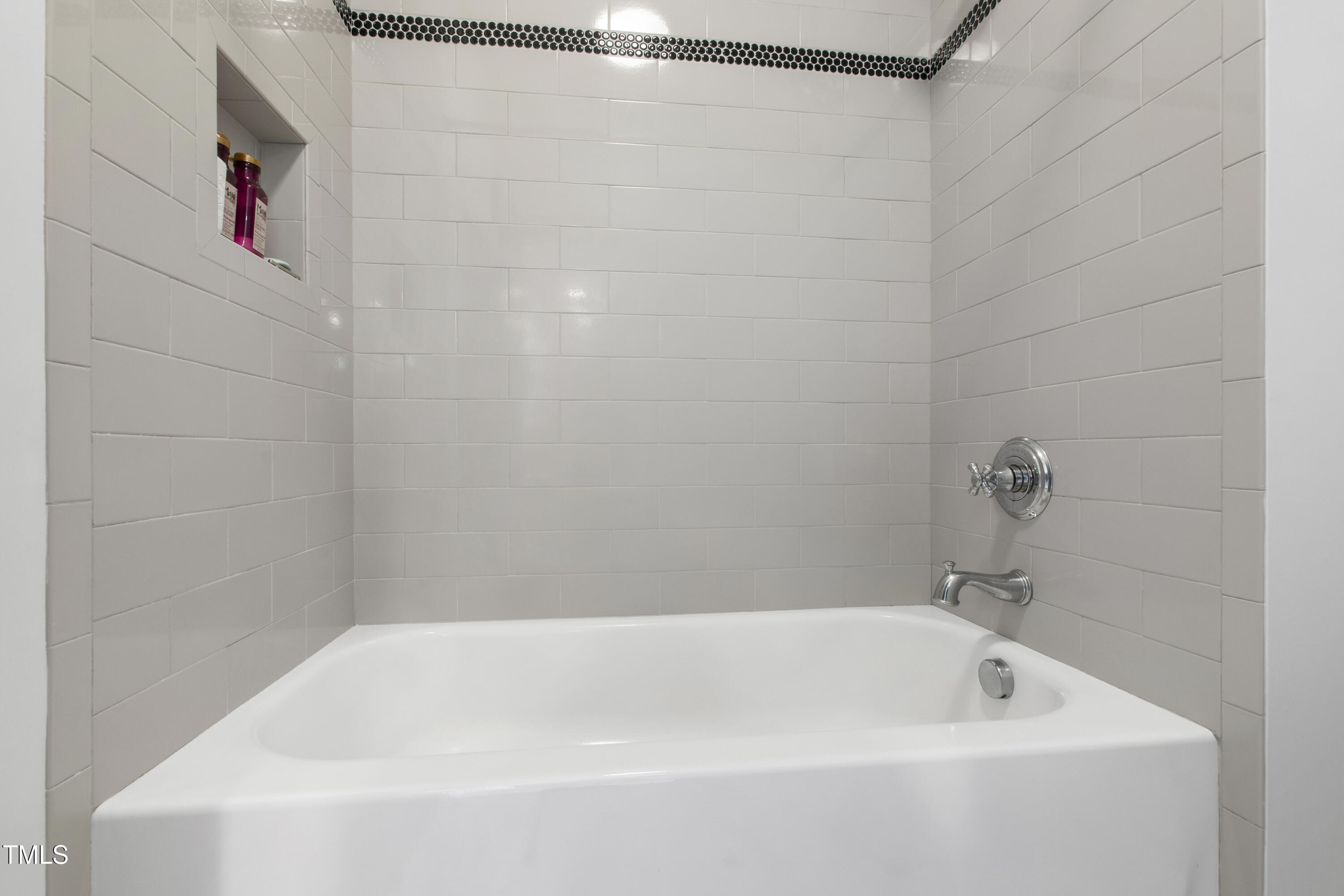 523 Vick Avenue Raleigh, NC 27612 - Photo 43 of 77 a bathroom with a white bath tub and a shower