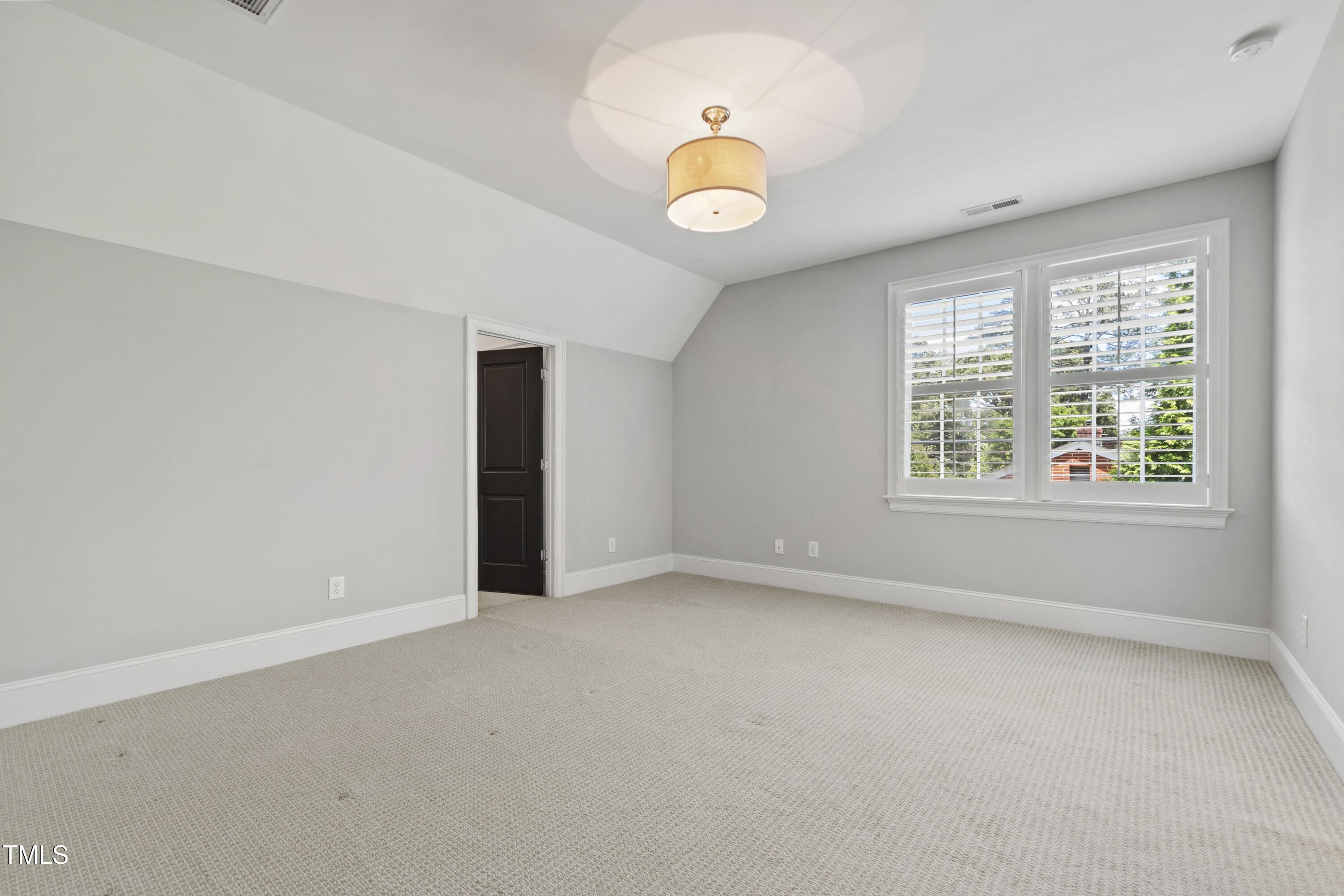 523 Vick Avenue Raleigh, NC 27612 - Photo 44 of 77 an empty room with windows and fan