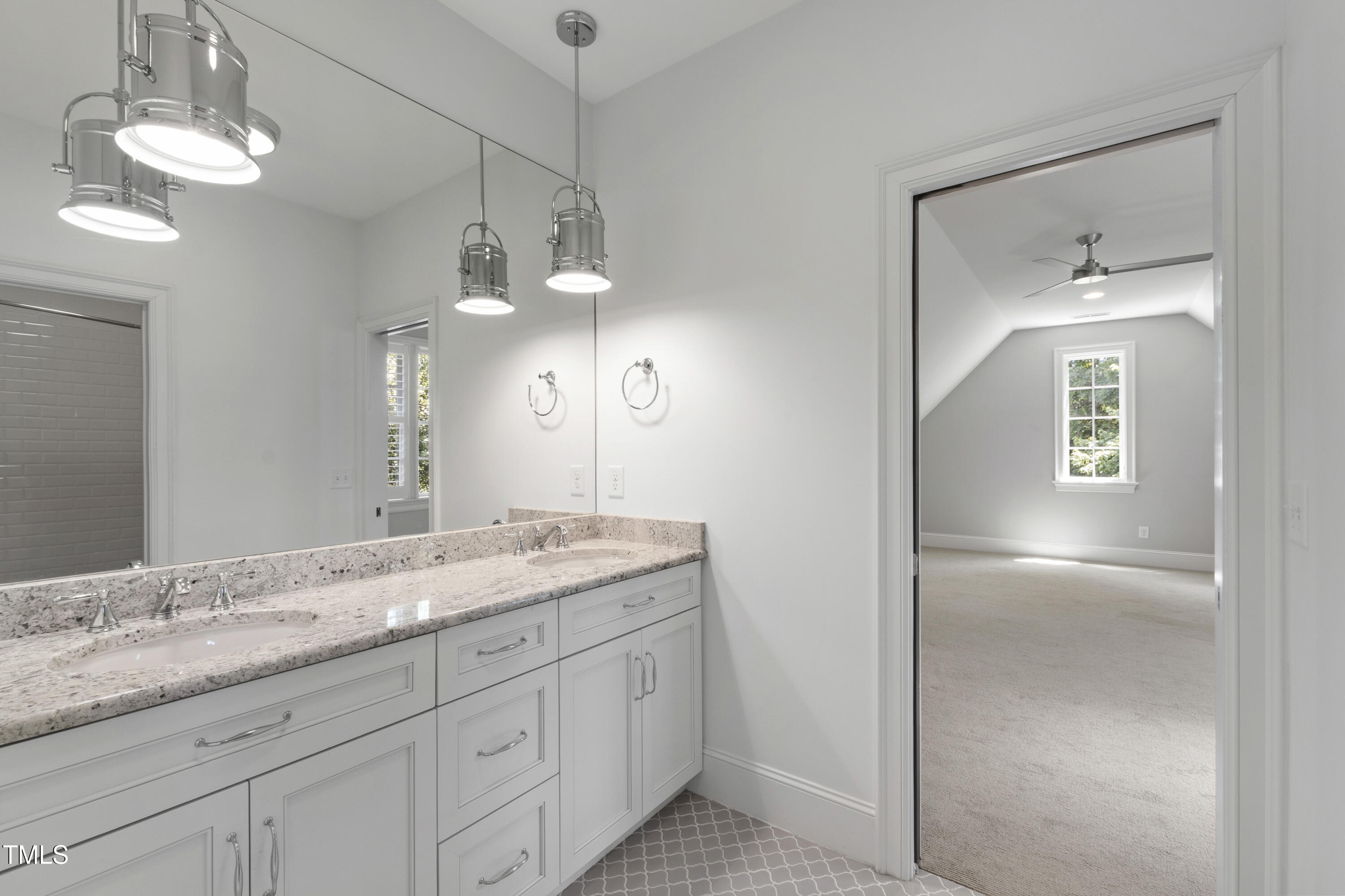 523 Vick Avenue Raleigh, NC 27612 - Photo 50 of 77 a bathroom with a granite countertop sink a light fixture and a mirror