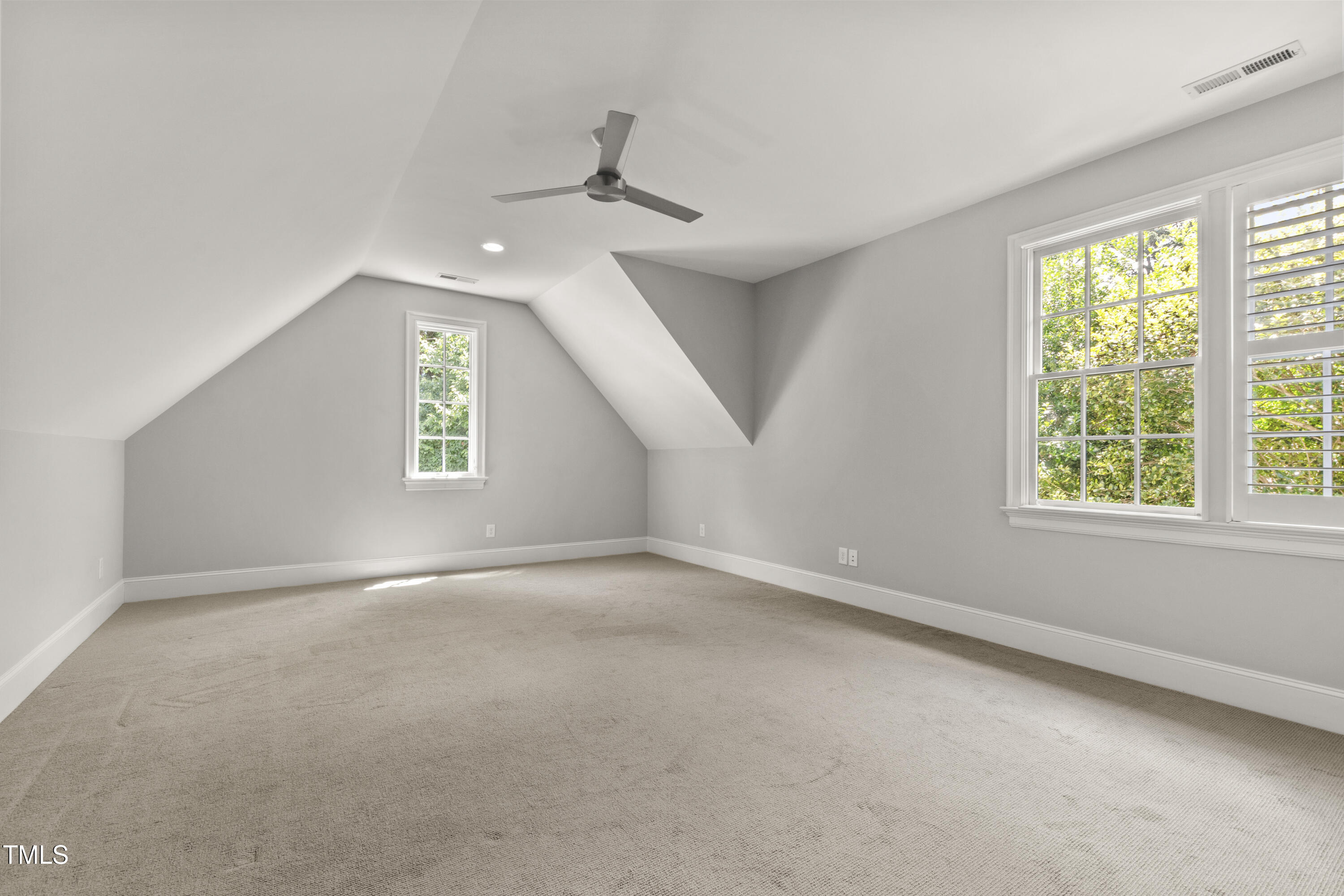 523 Vick Avenue Raleigh, NC 27612 - Photo 52 of 77 an empty room with a empty space and windows
