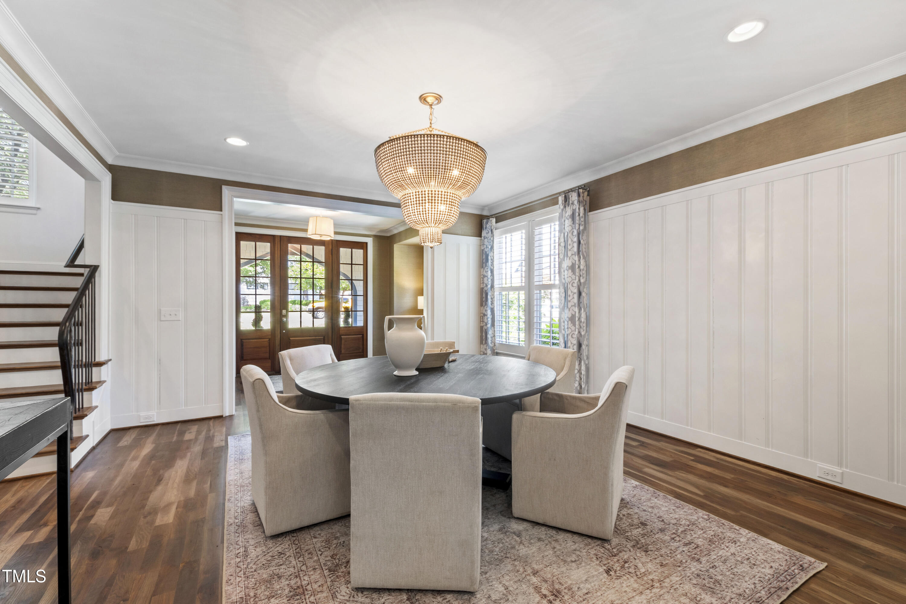 523 Vick Avenue Raleigh, NC 27612 - Photo 4 of 77 a dining room with wooden floor and chandelier