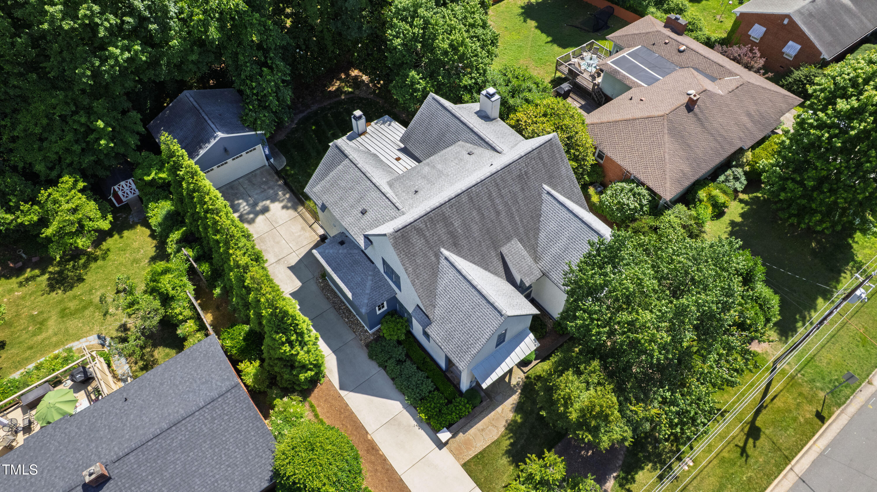 523 Vick Avenue Raleigh, NC 27612 - Photo 63 of 77 an aerial view of residential house with outdoor space and trees all around