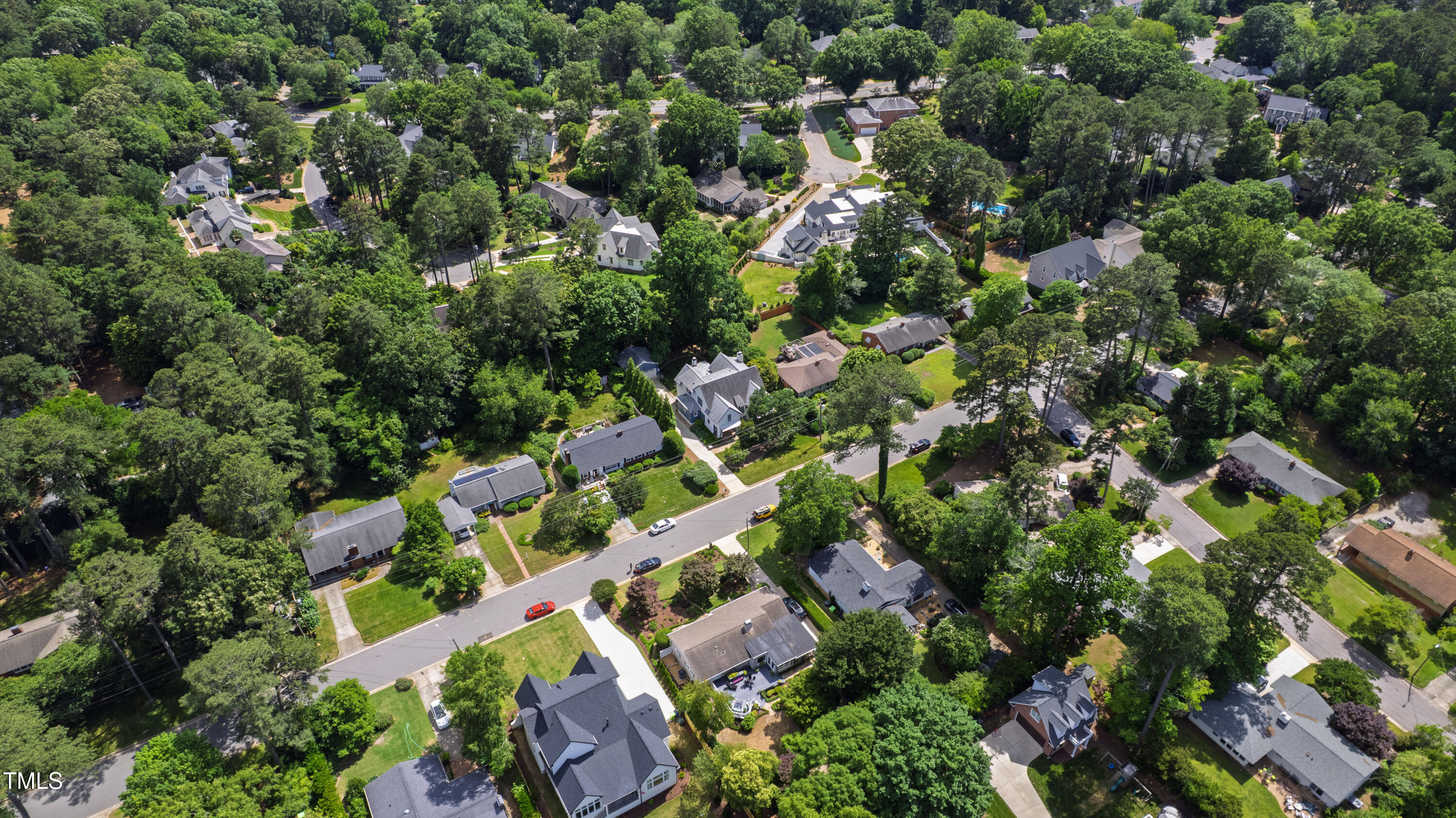 523 Vick Avenue Raleigh, NC 27612 - Photo 69 of 77 an aerial view of residential houses with outdoor space and trees