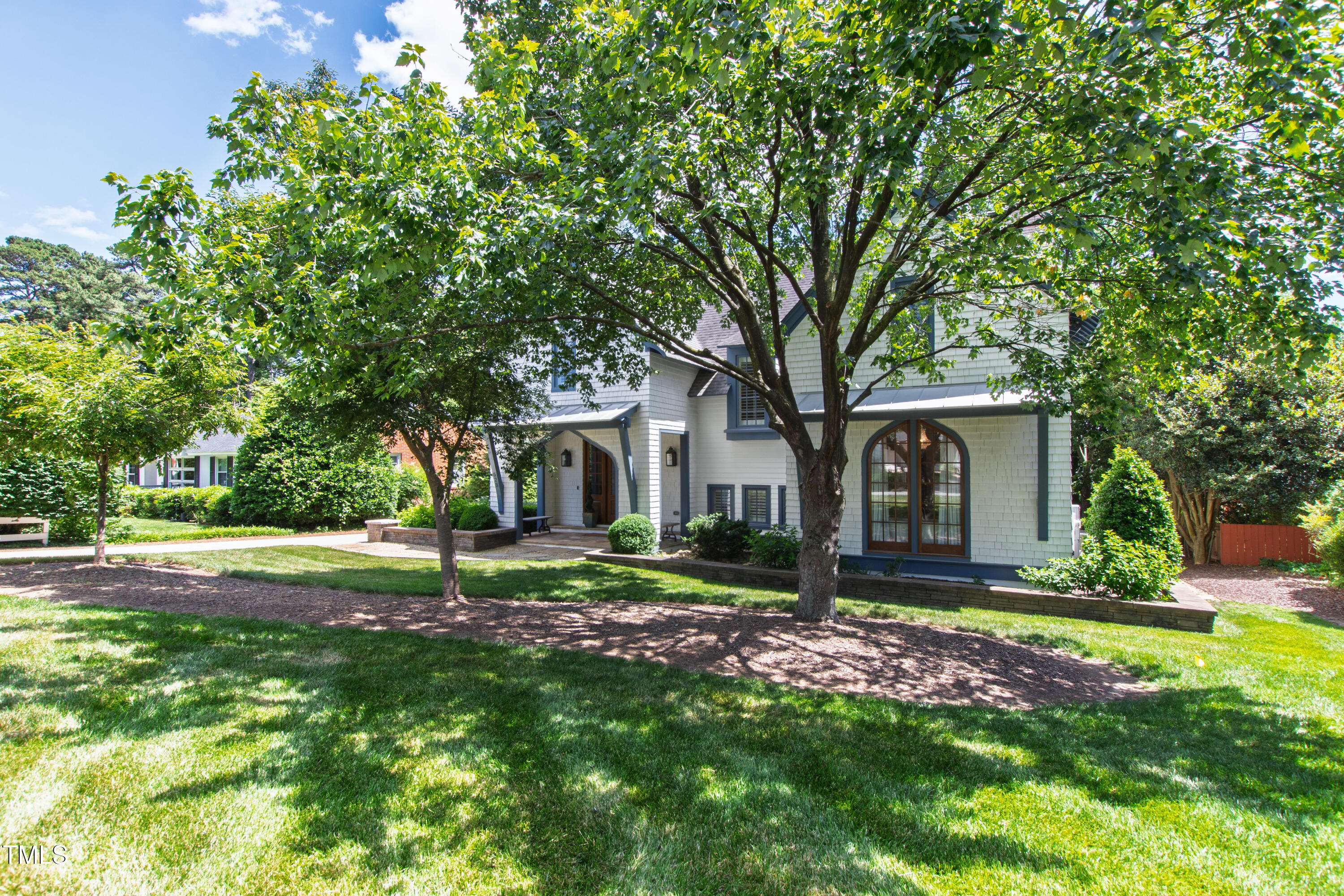 523 Vick Avenue Raleigh, NC 27612 - Photo 73 of 77 a house that has a tree in front of a house