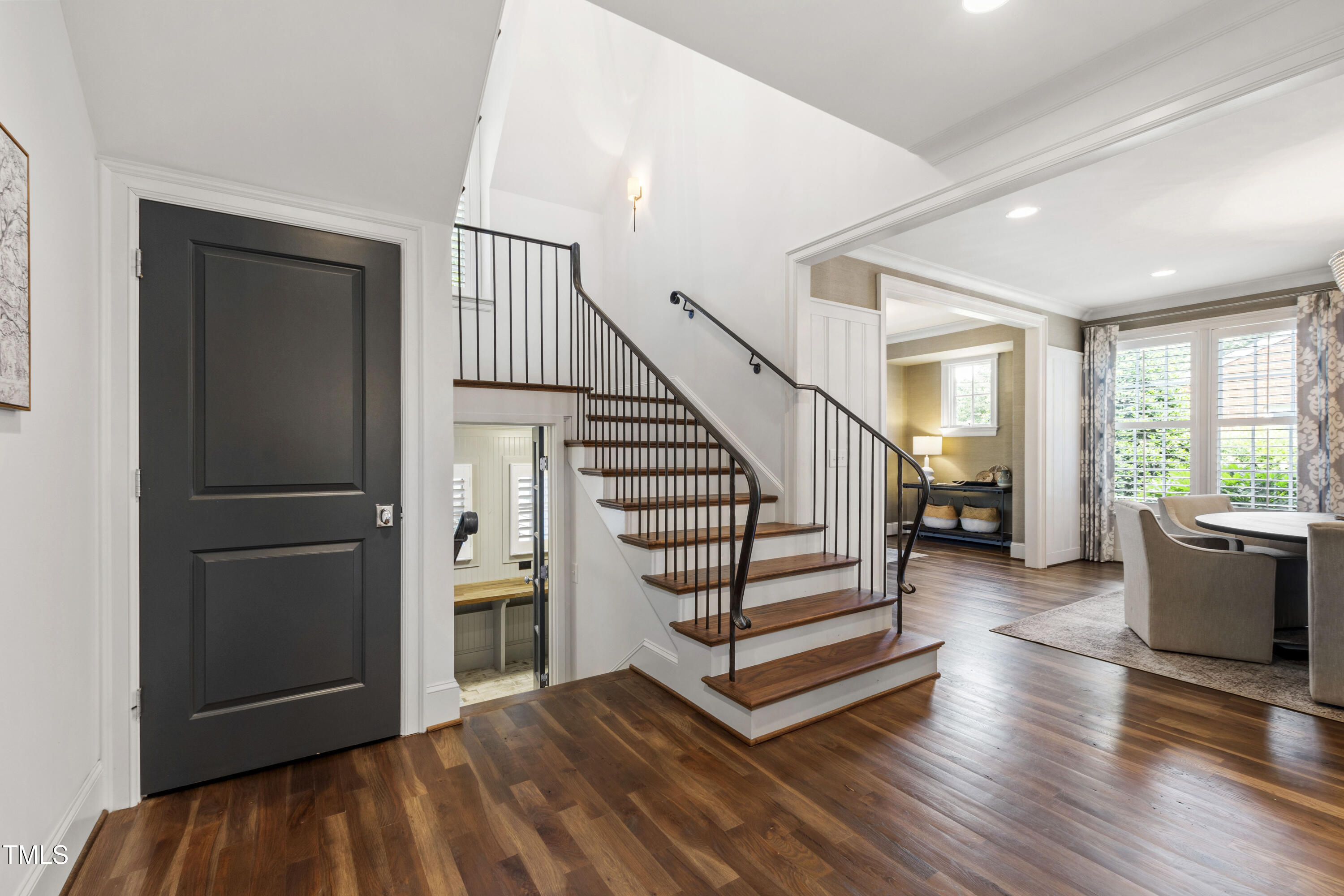 523 Vick Avenue Raleigh, NC 27612 - Photo 7 of 77 a view of entryway with wooden floor and stairs