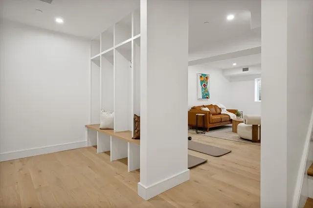 a living room with furniture and a lamp