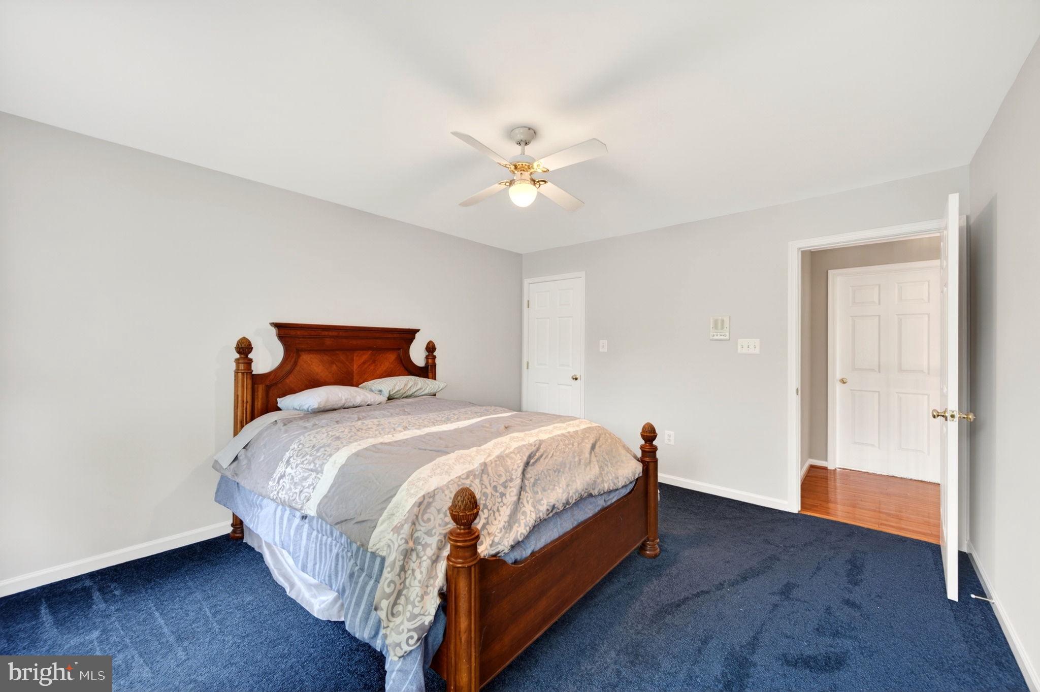 8 North Pointe Terrace Middletown, MD 21769 - Photo 43 of 74 a bedroom with a bed and wooden floor