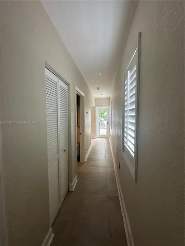a view of hallway with windows