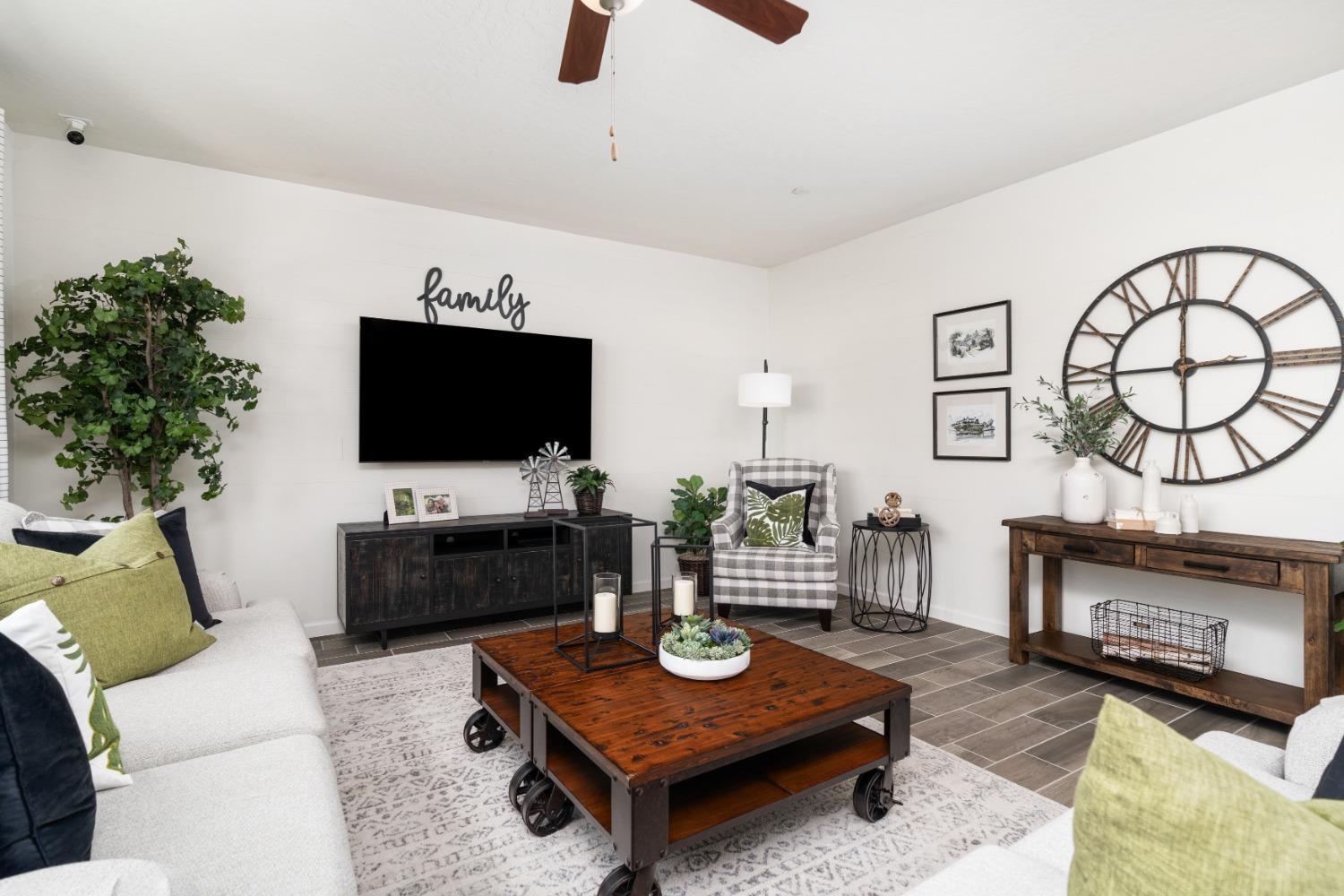 1198 Significant Way West Madera, CA 93636 - Photo 12 of 29 a living room with furniture and a flat screen tv