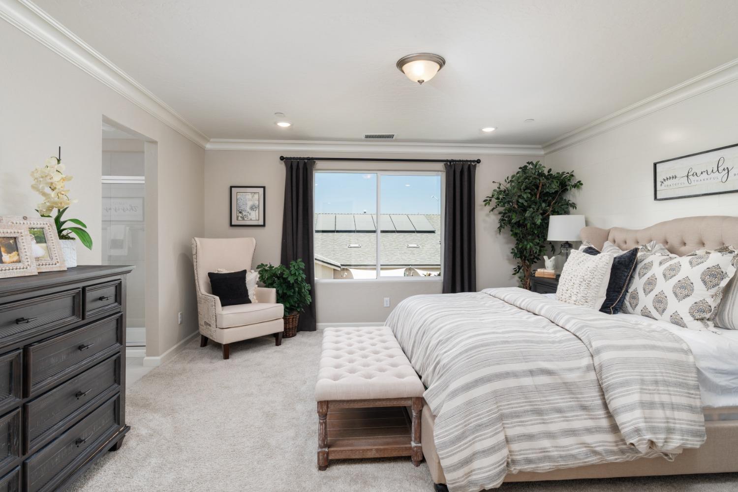 1198 Significant Way West Madera, CA 93636 - Photo 16 of 29 a bedroom with a bed and furniture