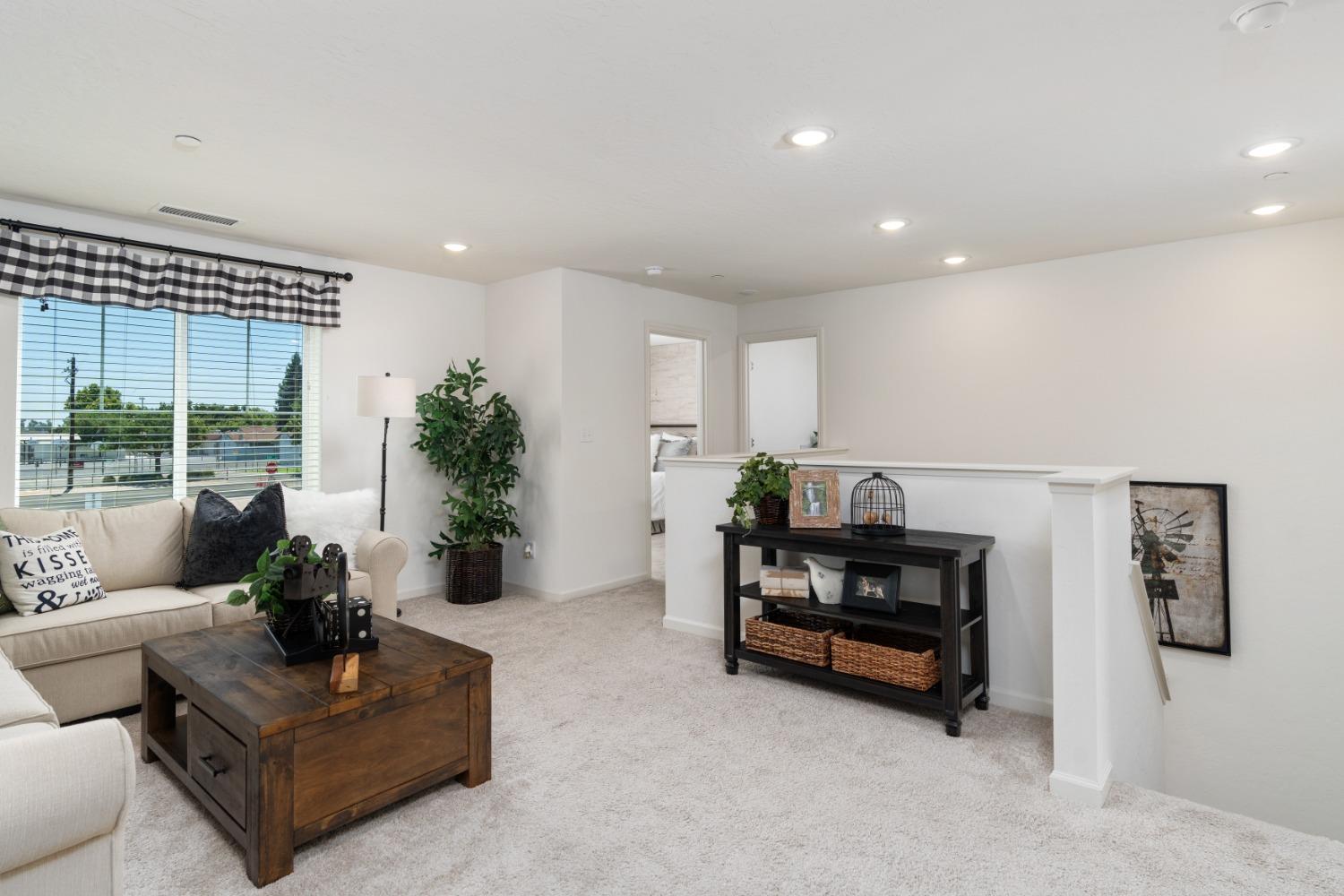 1198 Significant Way West Madera, CA 93636 - Photo 23 of 29 a living room with furniture and a table