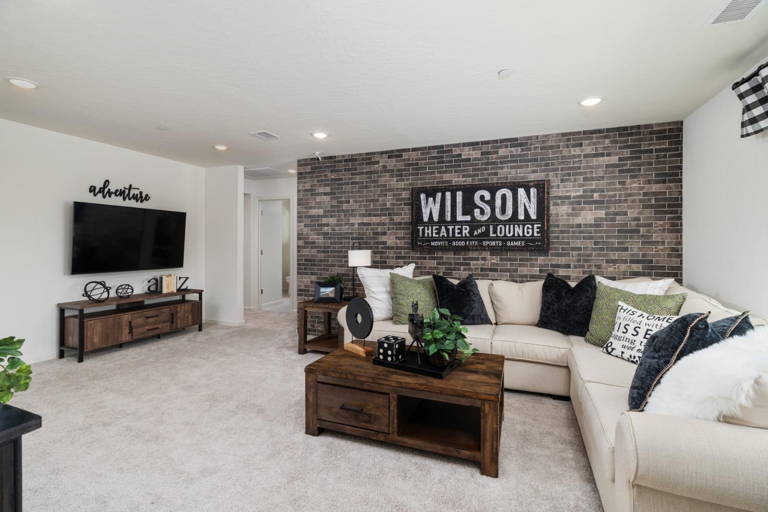 1198 Significant Way West Madera, CA 93636 - Photo 24 of 29 a living room with furniture and a flat screen tv