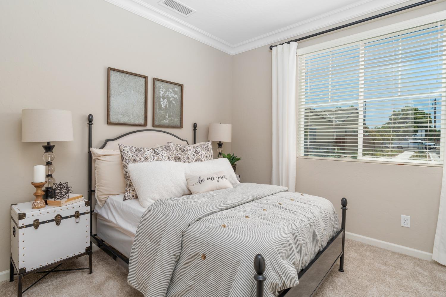 1198 Significant Way West Madera, CA 93636 - Photo 6 of 29 a bedroom with a bed and a night stand