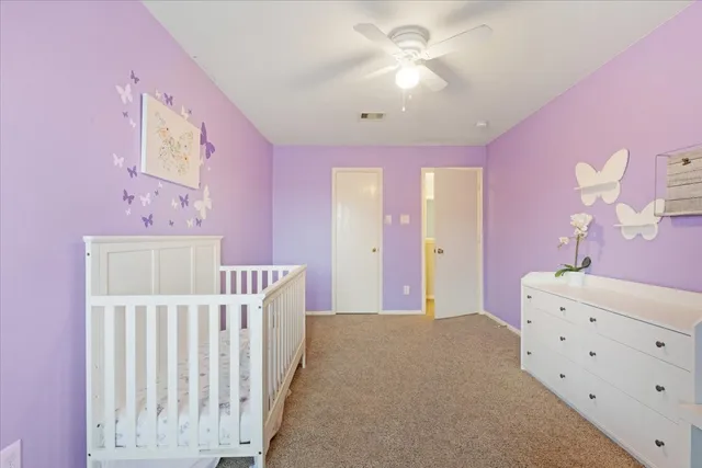 a bedroom with furniture and a chandelier