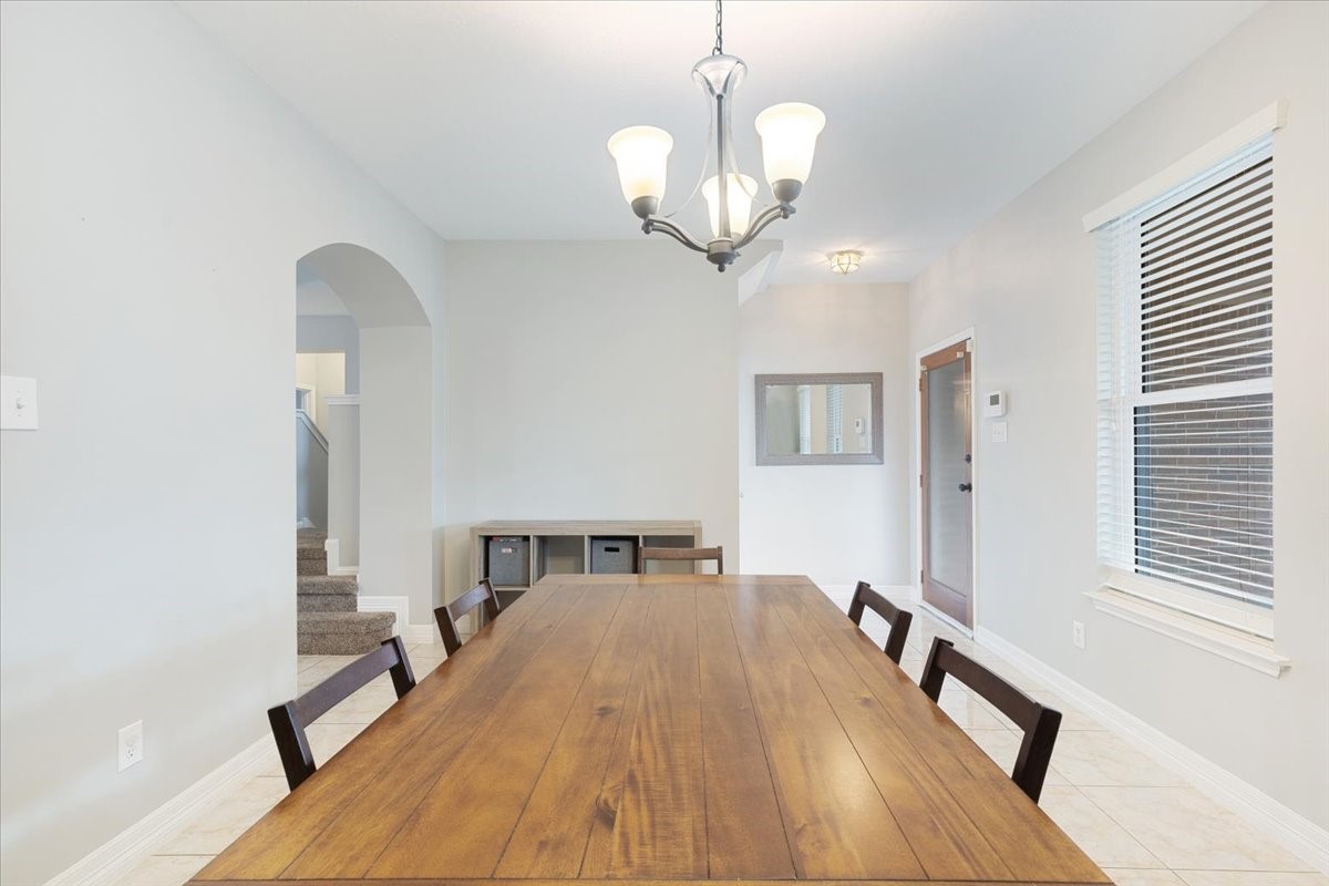 1202 Collier Point Lane Fresno, TX 77545 - Photo 5 of 29 This formal dining area highlights the perfect space for hosting friends or enjoying dinners with family.