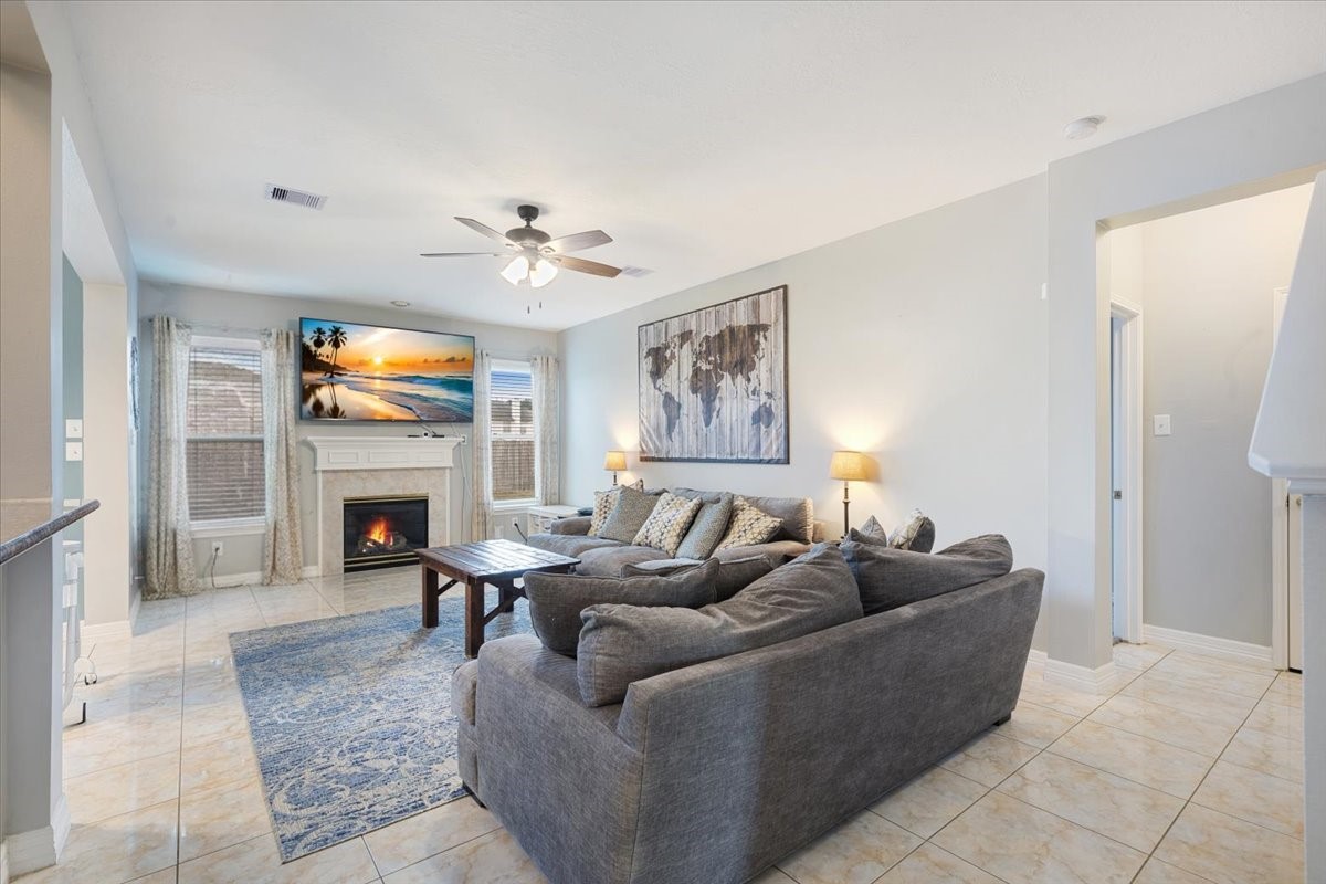1202 Collier Point Lane Fresno, TX 77545 - Photo 6 of 29 The open and spacious living room provides plenty of room to gather with family and friends. The TV mount will stay with the home.