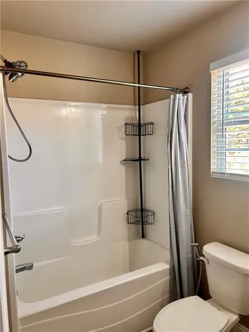a bathroom with a shower and a bathtub