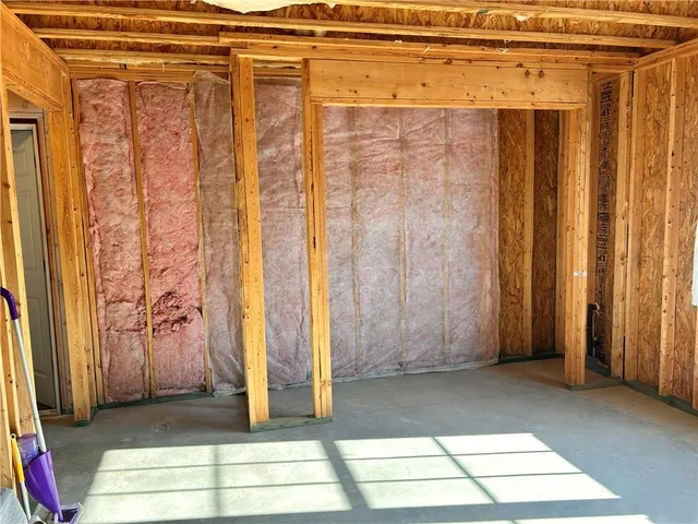 a view of entryway with wooden floor and stairs