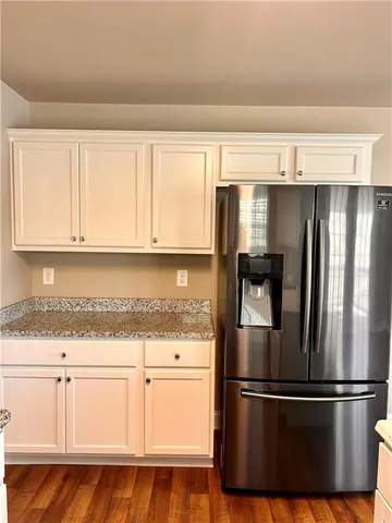a kitchen with appliances and cabinets