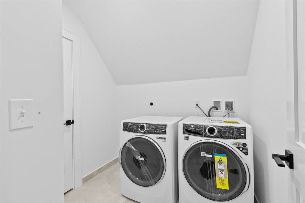 90 Addington Road, Unit 1 Brookline, MA 02445 - Photo 21 of 24 a utility room with dryer and washer